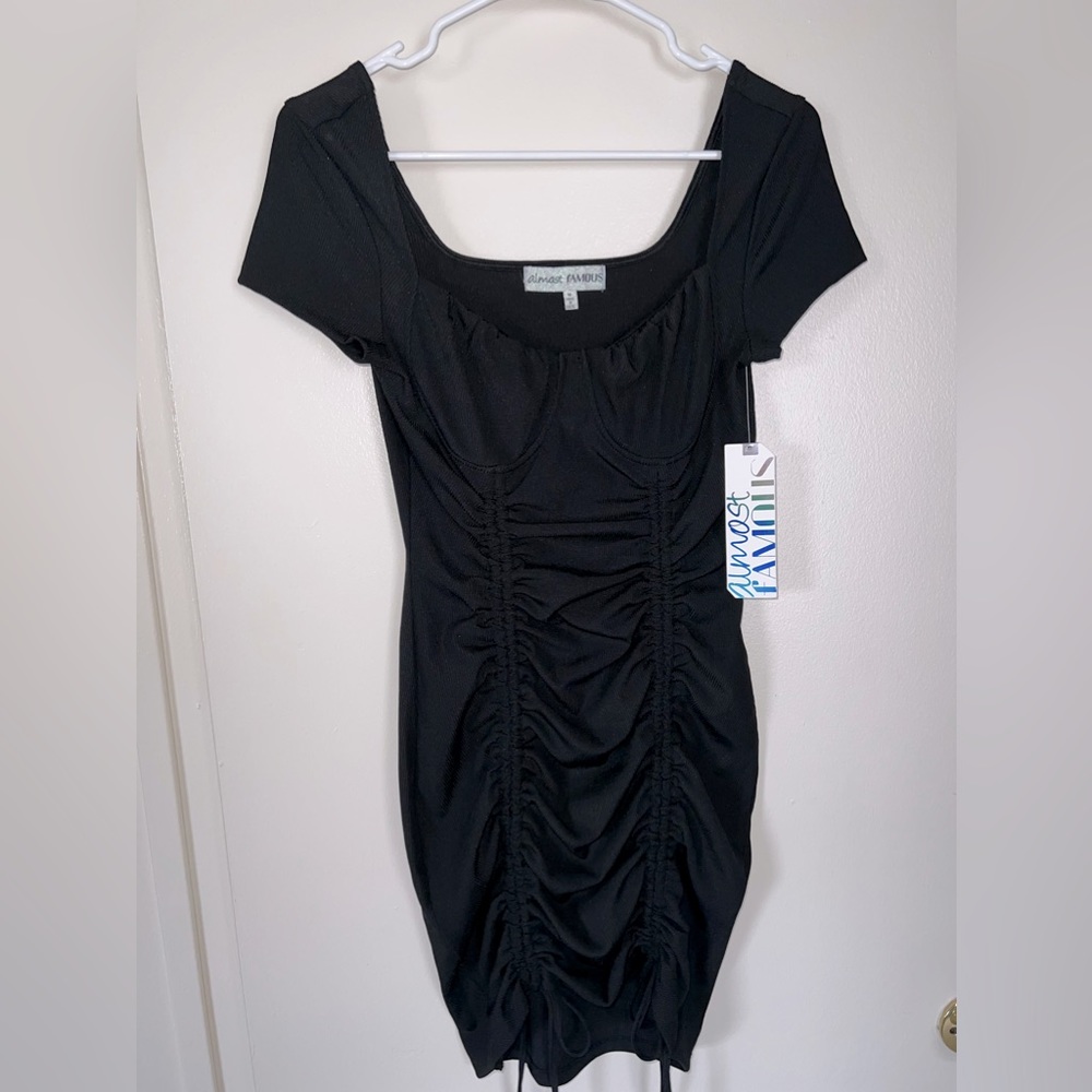 Black mini dress with underwire and 2 adjustable scrunches in the front